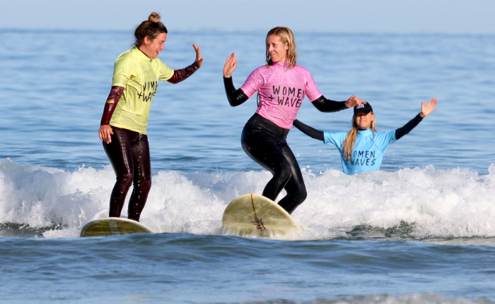 Women surfing