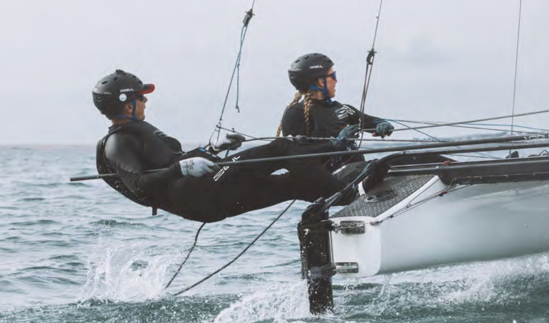 Two sailors on the open ocean in GUL Code Zero. 