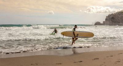 Surfers on the shore