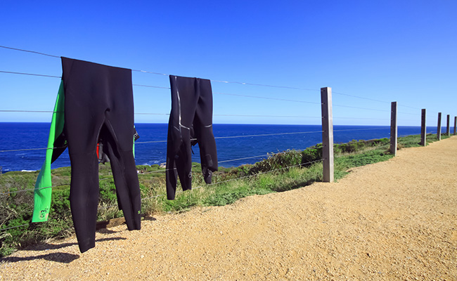 Wetsuits hanging out to dry
