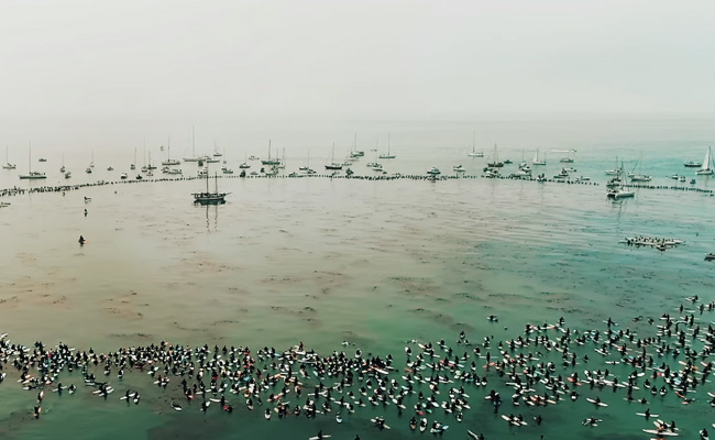 Hundreds of surfers paddle out for Jack O'Neill
